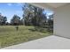 Covered patio overlooking a grassy backyard at 1744 Carnelian St, Deland, FL 32720