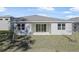 Home exterior showcasing a backyard and patio at 1744 Carnelian St, Deland, FL 32720