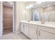 Double vanity bathroom with walk-in shower and closet at 1744 Carnelian St, Deland, FL 32720