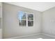 Bright bedroom with large window and neutral walls at 1744 Carnelian St, Deland, FL 32720