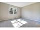 Spacious bedroom with carpeted floor and window at 1744 Carnelian St, Deland, FL 32720