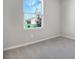 Spacious bedroom with large window and neutral decor at 1744 Carnelian St, Deland, FL 32720