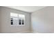 Simple bedroom with neutral walls and carpeted floor at 1744 Carnelian St, Deland, FL 32720