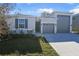 Two-story house with attached garage and landscaping at 1744 Carnelian St, Deland, FL 32720