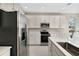 Modern kitchen with stainless steel appliances and white cabinets at 1744 Carnelian St, Deland, FL 32720