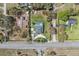 Bird's eye view of property showcasing the roof, pool and generous yard space, highlighting privacy and curb appeal at 1810 Markham Woods Rd, Longwood, FL 32779