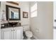 Stylish half-bathroom with a vessel sink and tasteful decor provide convenience for guests at 1810 Markham Woods Rd, Longwood, FL 32779