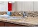 Close up of bathroom sink with granite countertop and chrome faucet at 1810 Markham Woods Rd, Longwood, FL 32779