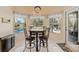 Bright breakfast nook with chandelier lighting has a pool view and tile floor at 1810 Markham Woods Rd, Longwood, FL 32779