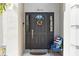 Inviting front door with decorative wreath and patriotic decorations at 1810 Markham Woods Rd, Longwood, FL 32779