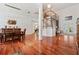 Open-concept living space featuring gleaming hardwood floors and lots of natural light at 1810 Markham Woods Rd, Longwood, FL 32779