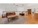 Open loft featuring a sofa, coffee table, bookshelf, and access to additional rooms at 1810 Markham Woods Rd, Longwood, FL 32779