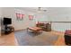 Bright loft with a comfortable sofa, tv, ceiling fan, and natural light from the windows at 1810 Markham Woods Rd, Longwood, FL 32779