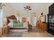 A spacious main bedroom with a large wooden bed, dresser, and bright natural lighting at 1810 Markham Woods Rd, Longwood, FL 32779