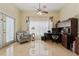 Bright home office featuring a comfortable patterned chair and a functional built-in desk area at 1810 Markham Woods Rd, Longwood, FL 32779