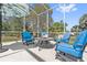 Inviting screened-in patio with comfortable seating, umbrella, and outdoor table at 1810 Markham Woods Rd, Longwood, FL 32779
