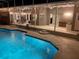 Backyard view of pool with patio and seating areas, ideal for enjoying the outdoors and entertaining guests at 1810 Markham Woods Rd, Longwood, FL 32779