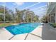 Sparkling pool with deck, landscaping, and views of the backyard at 1810 Markham Woods Rd, Longwood, FL 32779