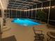Gorgeous pool area with enclosed lanai and patio seating, perfect for relaxing evenings and outdoor entertainment at 1810 Markham Woods Rd, Longwood, FL 32779