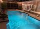 Beautiful pool with a screened-in lanai and outdoor seating, perfect for evening relaxation and entertaining at 1810 Markham Woods Rd, Longwood, FL 32779