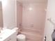 Functional bathroom features tiled shower/tub combo and vanity storage at 4815 Jay Dr, St Cloud, FL 34772