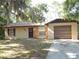 Charming single-story home with stone accents, a one-car garage, and a well-maintained front lawn at 4815 Jay Dr, St Cloud, FL 34772