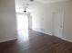 Bright living room with ceiling fan, laminate flooring and sliding glass doors leading to patio at 4815 Jay Dr, St Cloud, FL 34772