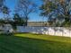 Backyard with lush lawn and white fence at 545 Pintail Cir, Auburndale, FL 33823