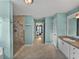 Large bathroom with walk-in shower and tile flooring at 545 Pintail Cir, Auburndale, FL 33823