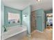 Bathroom features a bathtub and shower, updated vanity at 545 Pintail Cir, Auburndale, FL 33823