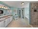 Spa-like bathroom with double vanity, large shower, and soaking tub at 545 Pintail Cir, Auburndale, FL 33823
