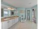 Elegant bathroom with double vanity, separate shower and tub at 545 Pintail Cir, Auburndale, FL 33823