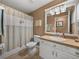 Updated bathroom with tub/shower combo and white vanity at 545 Pintail Cir, Auburndale, FL 33823