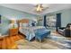 Relaxing Primary bedroom with wood floors and ensuite bath access at 545 Pintail Cir, Auburndale, FL 33823