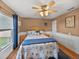Guest bedroom with a queen-size bed and wood floors at 545 Pintail Cir, Auburndale, FL 33823