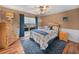 Cozy bedroom with wood flooring, window, and ceiling fan at 545 Pintail Cir, Auburndale, FL 33823