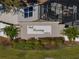 Oak Crossing North community entrance sign with landscaping at 545 Pintail Cir, Auburndale, FL 33823