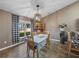 Bright dining area with a table and chairs, and a charming china cabinet at 545 Pintail Cir, Auburndale, FL 33823
