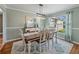 Farmhouse-style dining room with a rustic wooden table and chandelier at 545 Pintail Cir, Auburndale, FL 33823