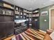 Home theater room with built-in shelving and large TV at 545 Pintail Cir, Auburndale, FL 33823