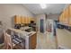 Kitchen with wood cabinets, stainless steel appliances, and a breakfast bar at 545 Pintail Cir, Auburndale, FL 33823
