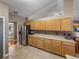 Modern kitchen with stainless steel appliances and wood cabinets at 545 Pintail Cir, Auburndale, FL 33823