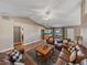 Spacious living room with leather sofas, coffee table, and large aquarium at 545 Pintail Cir, Auburndale, FL 33823