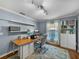 Bright home office features a large desk and dual monitors at 545 Pintail Cir, Auburndale, FL 33823