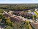 Community overview featuring Spanish-style homes and a lake at 8121 Roseville Blvd, Davenport, FL 33896