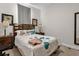Cozy bedroom with a double bed, nightstands, and window coverings at 8121 Roseville Blvd, Davenport, FL 33896