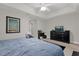 Bedroom with dresser, TV, and comfortable bed at 8121 Roseville Blvd, Davenport, FL 33896