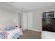 Bedroom with a double bed, dresser, and closet at 8121 Roseville Blvd, Davenport, FL 33896