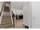 Bright entryway with tile flooring, staircase, and view of kitchen at 8121 Roseville Blvd, Davenport, FL 33896