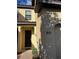 Townhome entrance with dark brown door and light beige walls at 8121 Roseville Blvd, Davenport, FL 33896